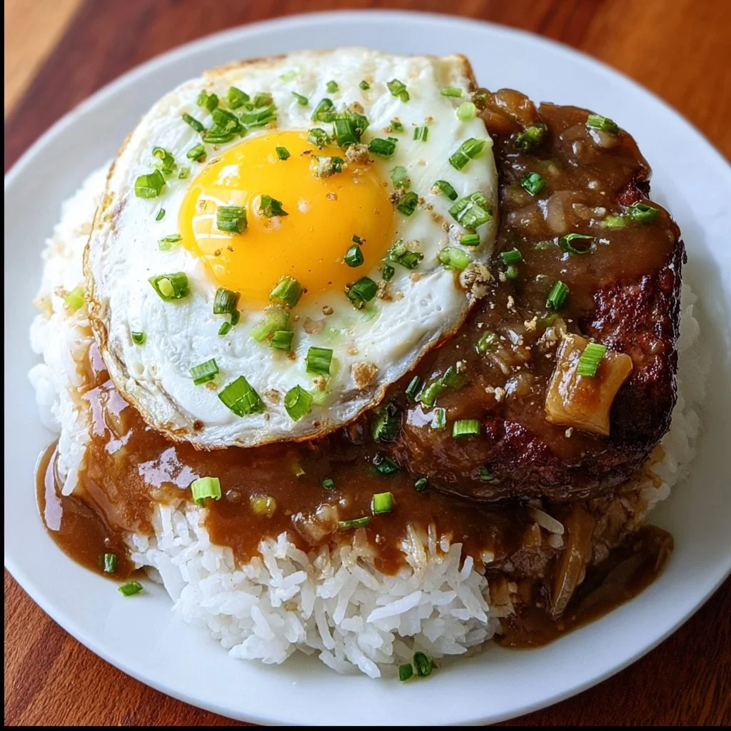 A hearty bowl of Hawaiian loco moco with rice, hamburger patty, gravy, and egg