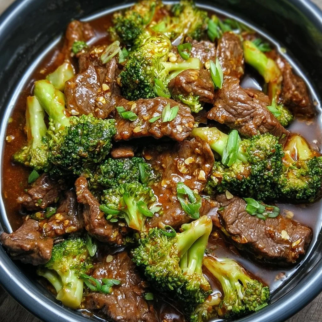 Delicious beef and broccoli stir-fry served in a bowl with rice and vegetables.
