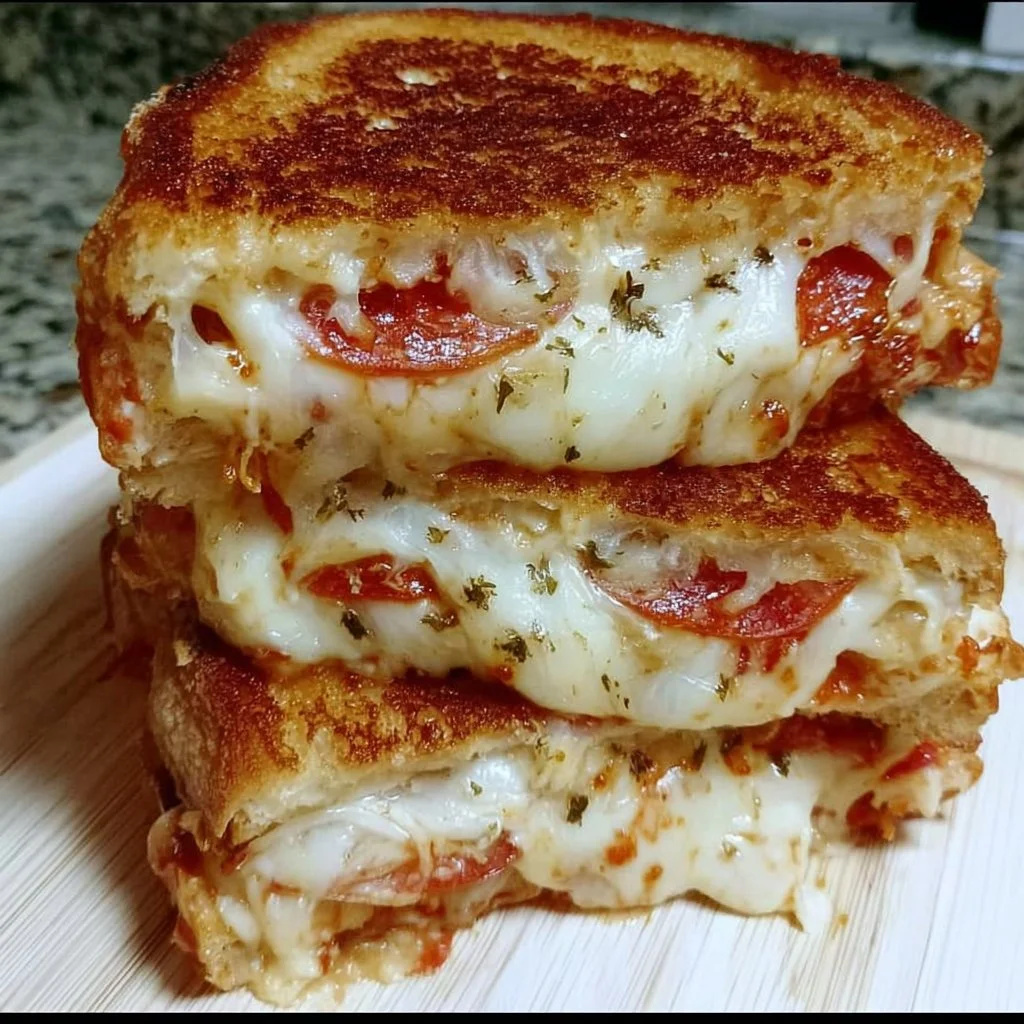 Delicious Pizza Grilled Cheese Sandwich with melted cheese and pizza toppings