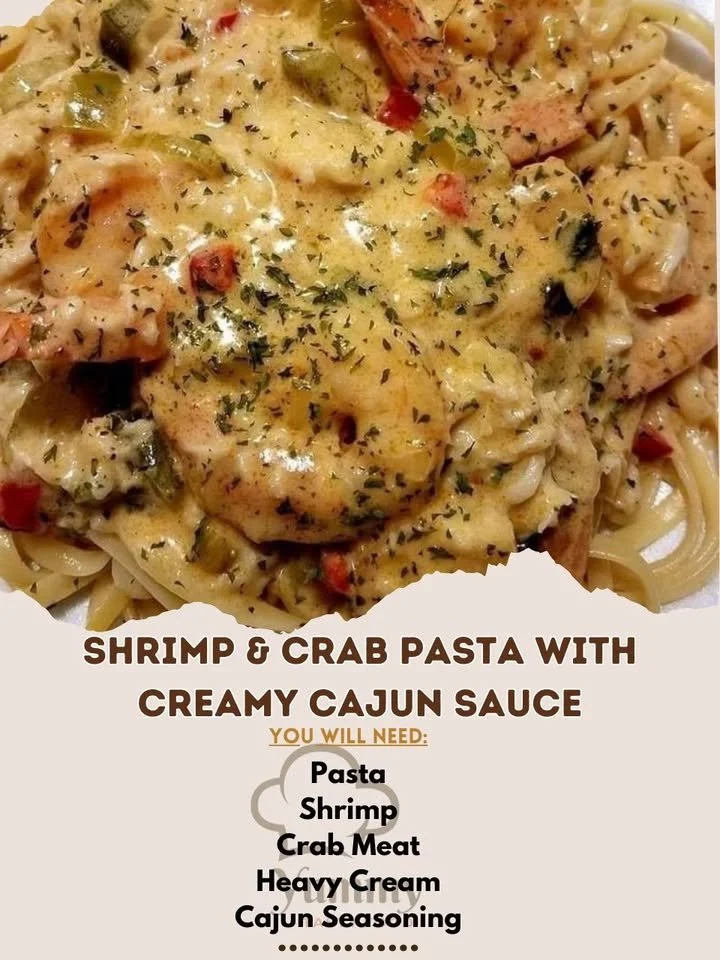 Creamy Cajun shrimp and crab pasta served in a bowl with herbs.