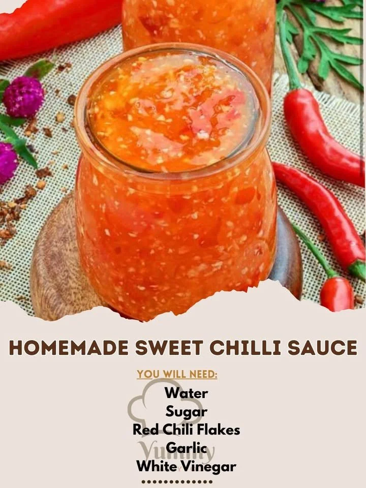 Homemade sweet chilli sauce in a glass jar with fresh ingredients around it.